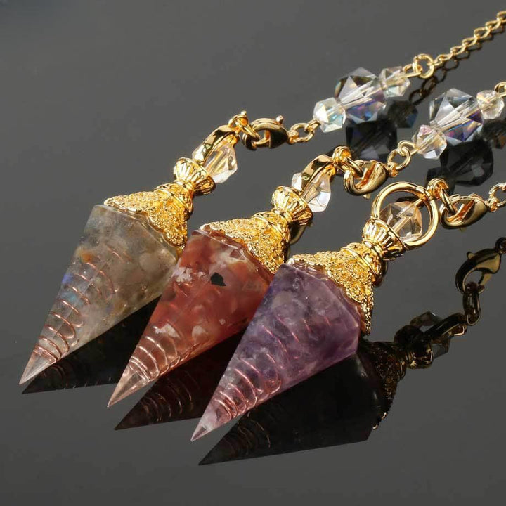 pendulum crystal gemstone hexagonal point pendant on the table