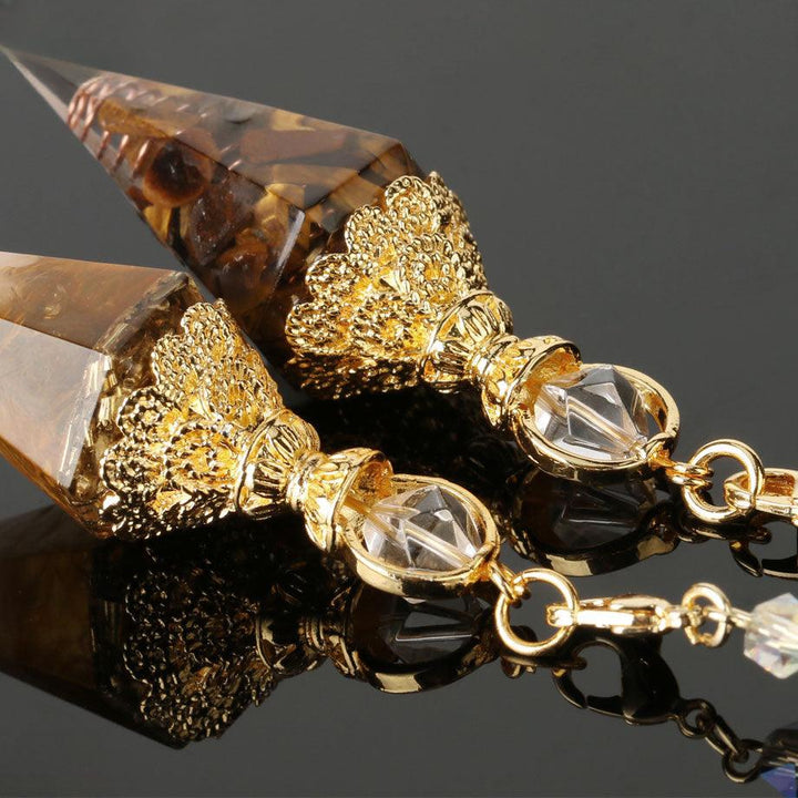 pendulum crystal gemstone hexagonal point pendant on the table