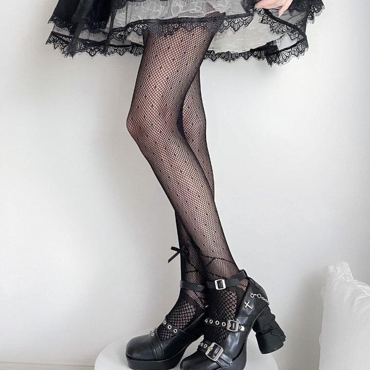 a woman wear polka dot bow mesh black pantyhose