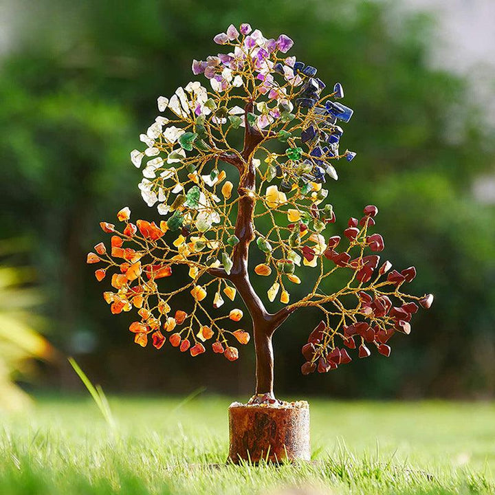 rainbow crystal bonsai tree with wooden base on the ground