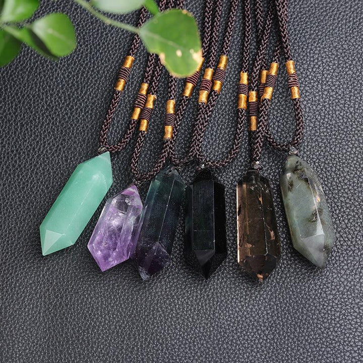 real crystal pillar pendant jewelry energy stone necklace on the table