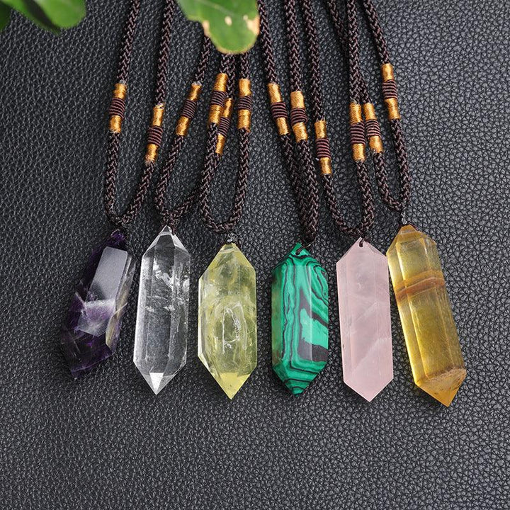 real crystal pillar pendant jewelry energy stone necklace on the table