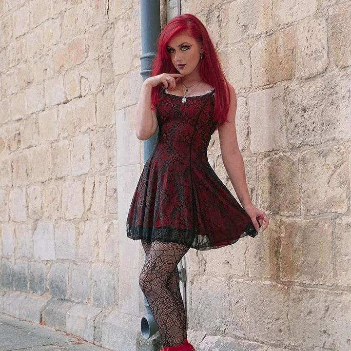 a woman wear a red and black gothic fashion corset dress