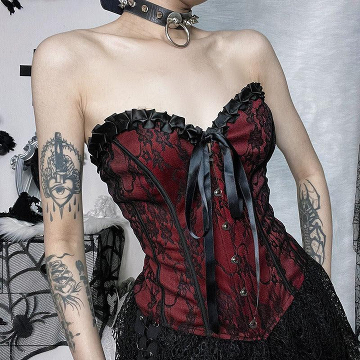 a woman wear a red and black gothic lace tie up top