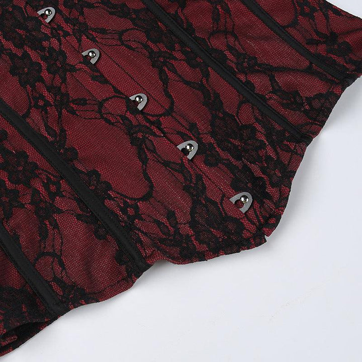 details of red and black gothic lace tie up top