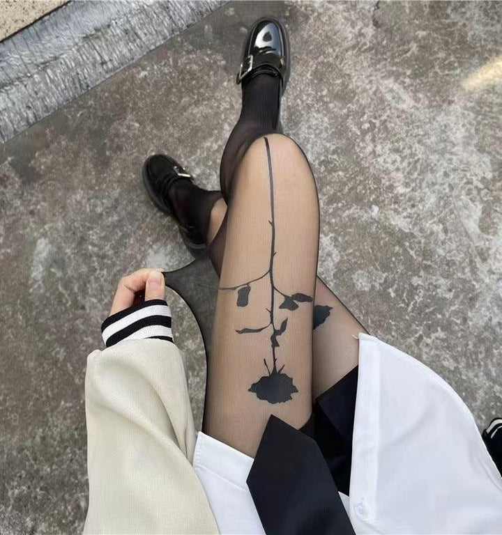 a woman wear sexy rose flower black pantyhose set on the chair