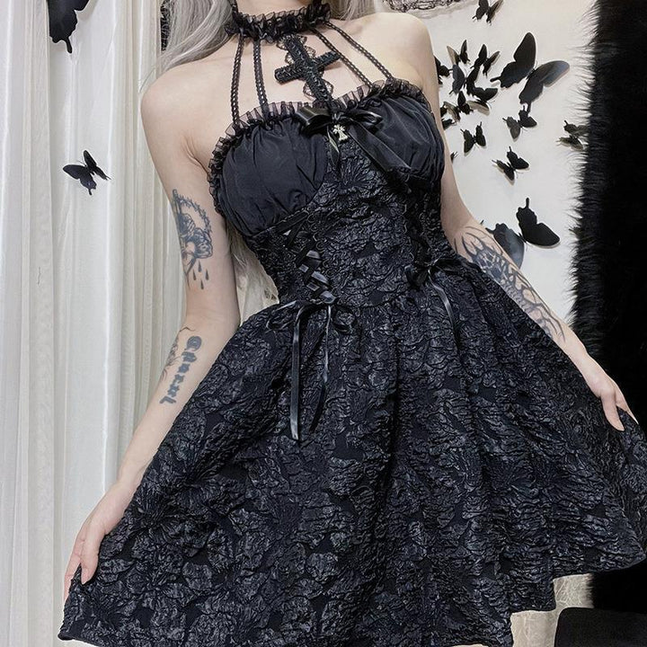 a woman wear a sleeveless short black gothic vampire dress