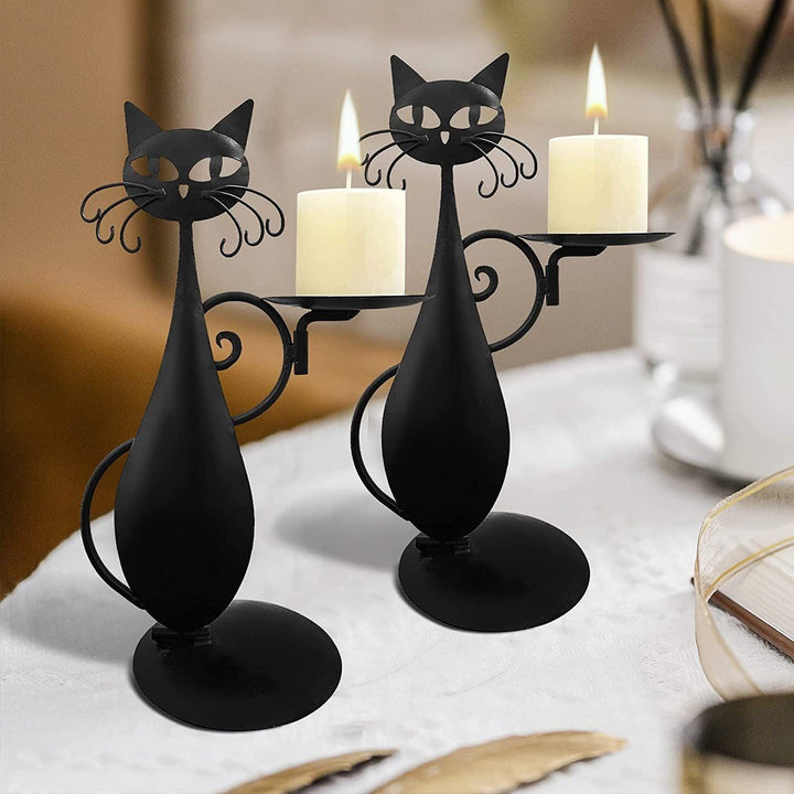 two vintage farmhouse gothic black cat candle holder ornament on the table