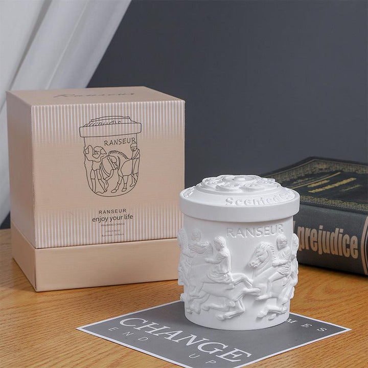 details of vintage statue plant wax plaster aromatherapy scented candles on the table