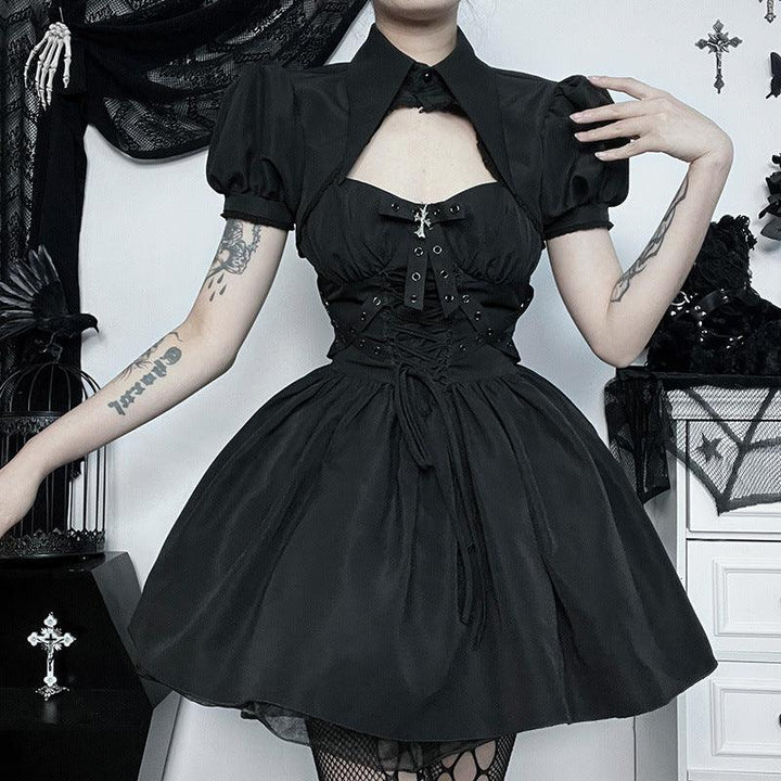 a woman wear a black gothic lolita ribbon strap dress