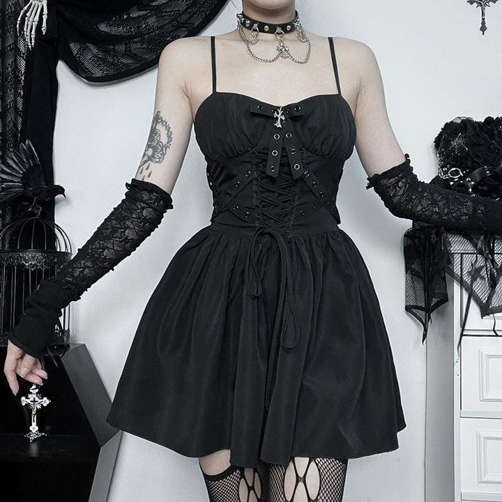 a woman wear a black gothic lolita ribbon strap dress